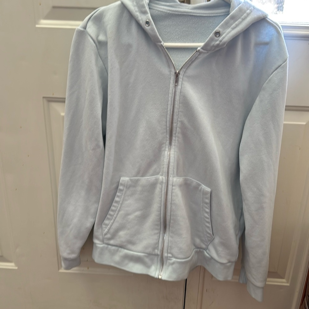 Light blue sweater with hoodie medium size in very good condition